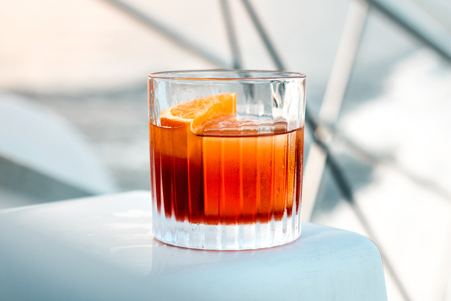 Campari Orange aperitif on a ship deck at sunset