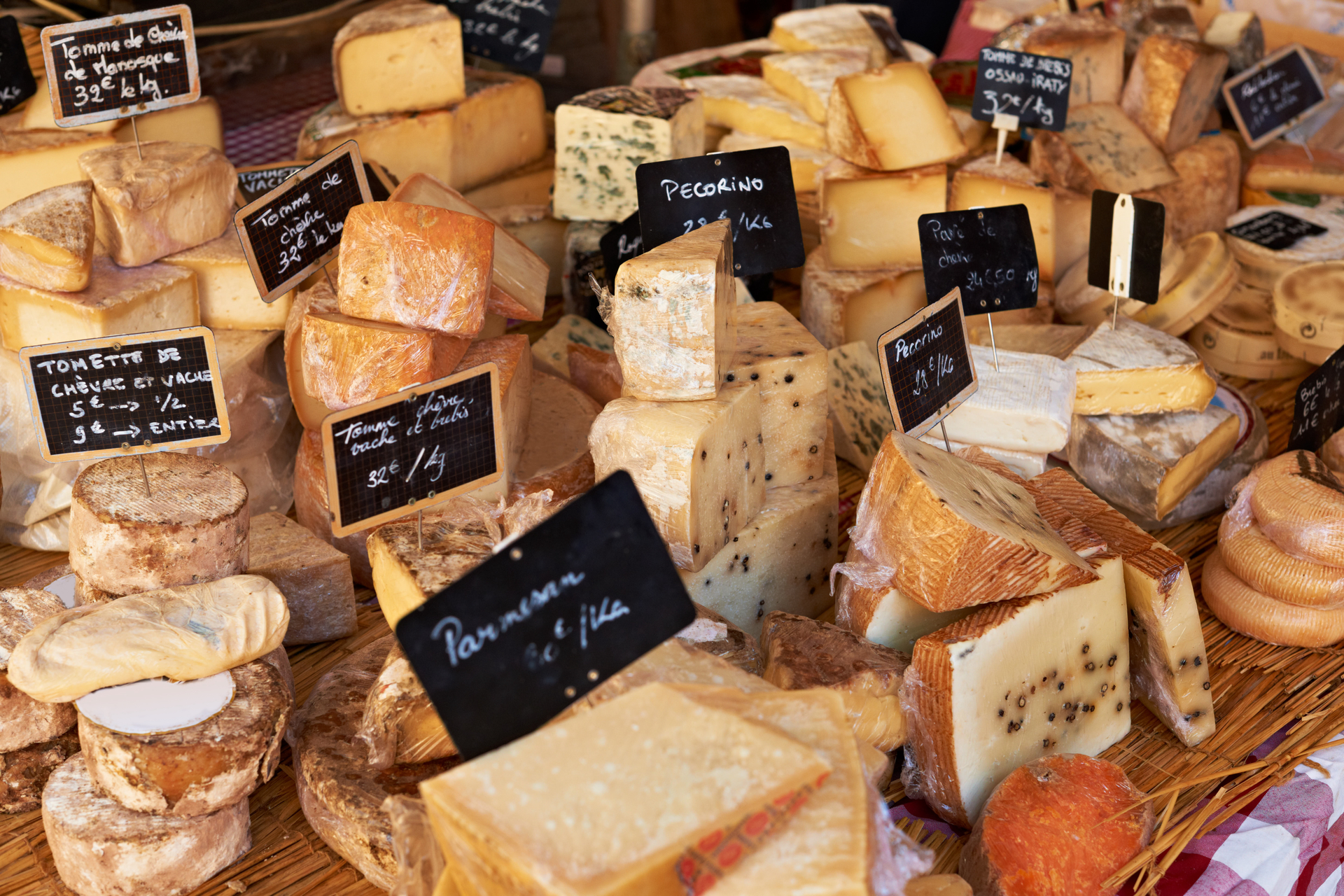 Various cheeses at a weekly market