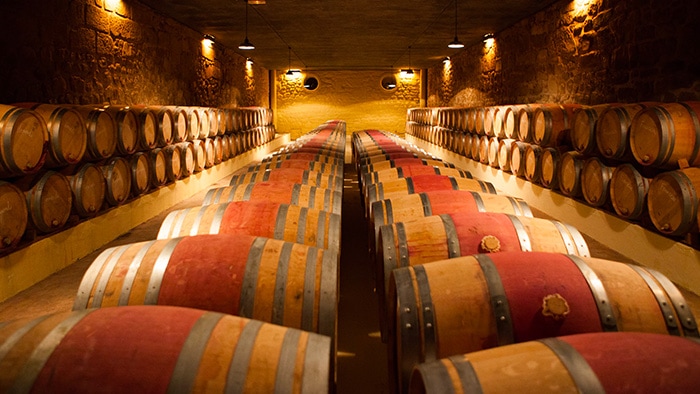 Barrique barrels in a wine cellar