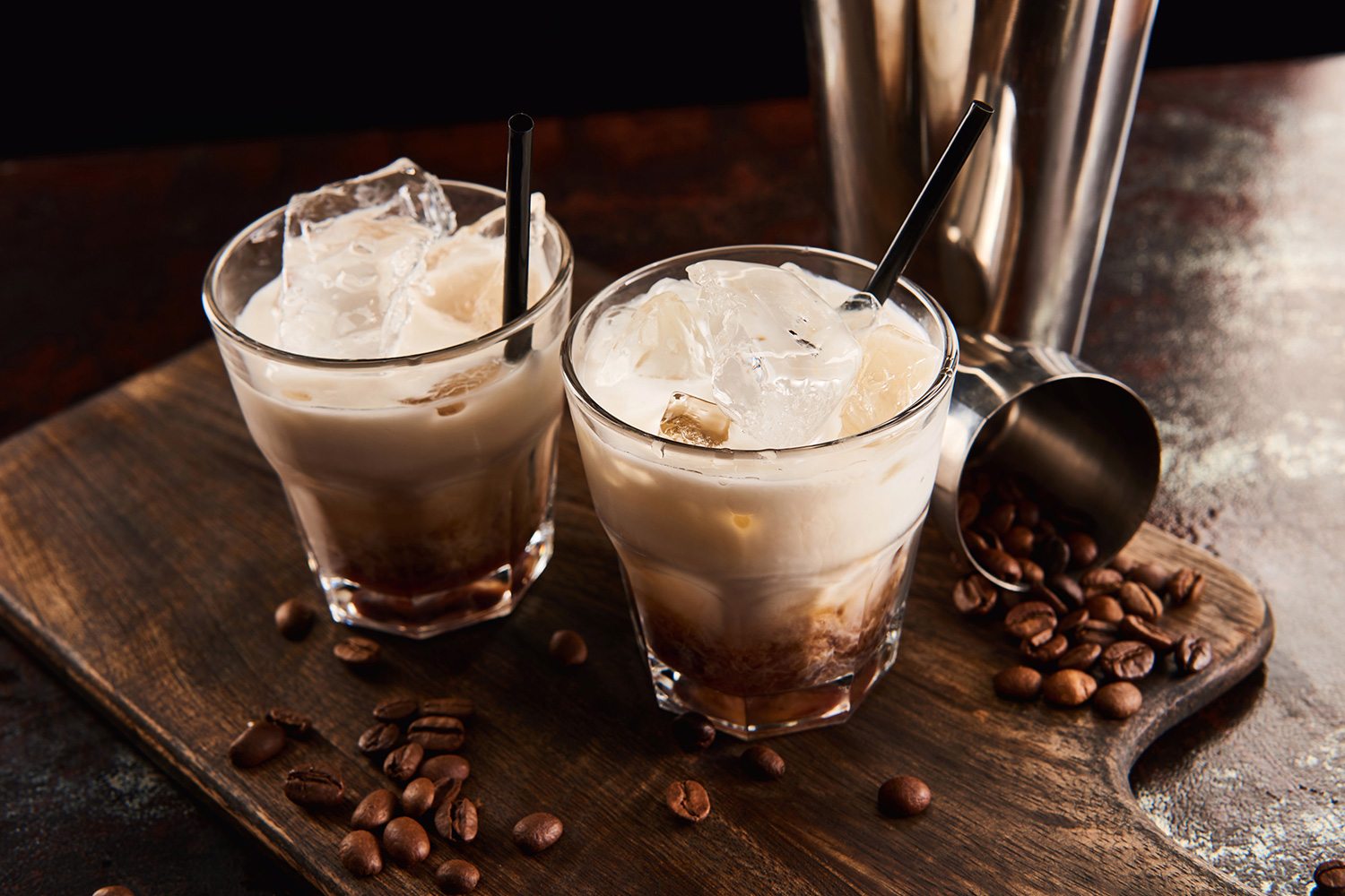 White Russian in a glass with straw